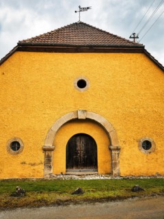 Yellow-painted farm building