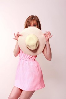 Woman with hat in hand