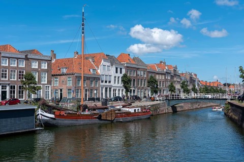 Townscape with traditional flat-bottomed sailing boat at Bierkaai