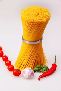 Spaghetti standing with fresh spices and vegetables