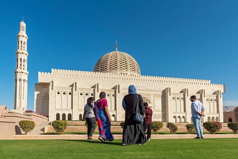 Indian family visiting Sultan Qaboos Grand Mosque