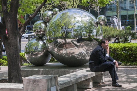 Man sitting and smoking by modern art
