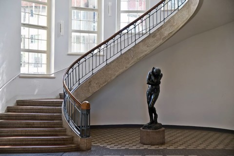 Foyer with free-swinging Art Nouveau staircase and Auguste Rodin's Eva