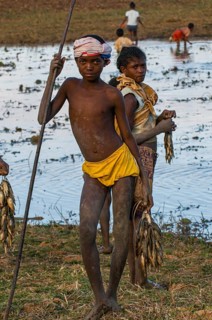 Proud boy presenting his fresh caught fish