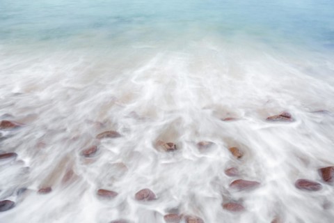 Detail of the swell on a sand and stone beach on the north-west coast of Scotland