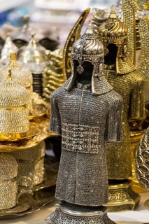 Medieval steel and gold colored armours in the view