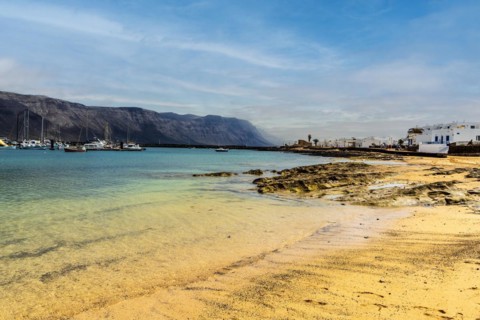 Beach and white architecture in Caleta del Sebo