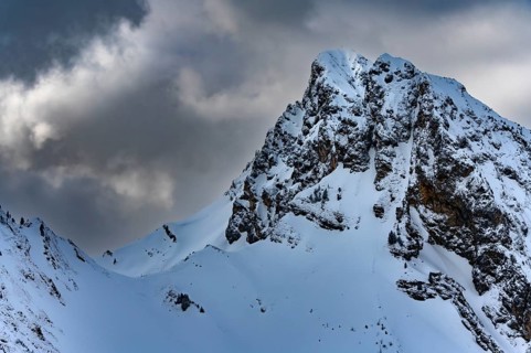 Peak of the Koellenspitze in snowy mountain landscape
