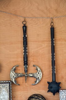 War axe and mace on a wooden background