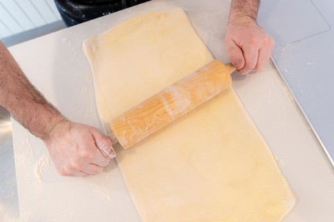 Man baking homemade croissants