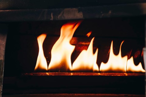 The yellow flames in a stone oven in display
