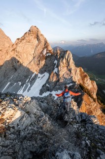 Hikers at the summit of Schartschrofen at sunset