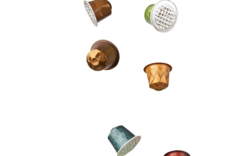 Different coloured used coffee capsules