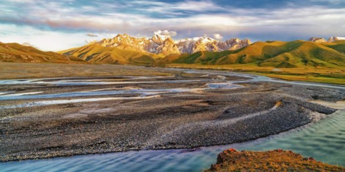 Sunset over the Central Tien Shan Mountains and glacier river