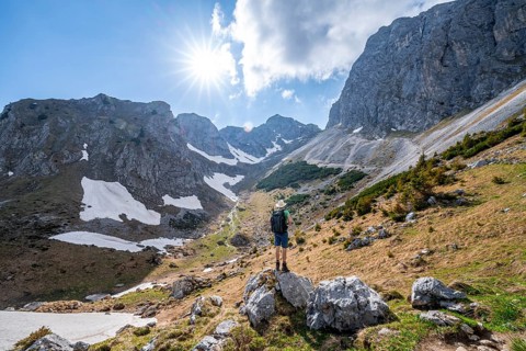 Hiker standing on a stone
