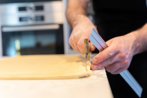 Man baking homemade croissants