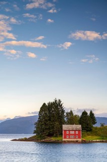 Typical red house on the island of Omaholmen in Hardangerfjord