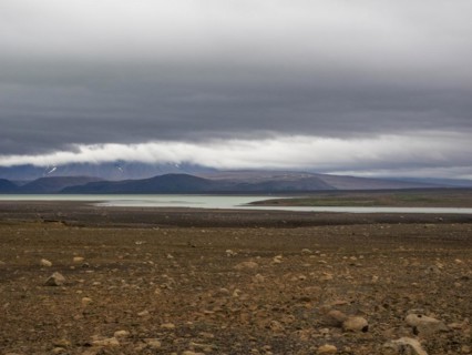 Glacial lake and barren volcanic landscape