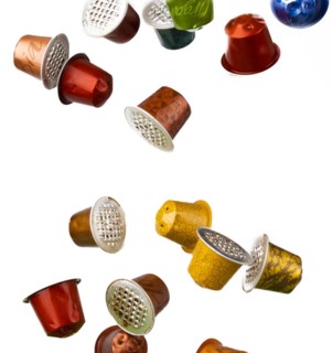 Different coloured used coffee capsules