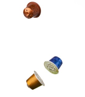 Different coloured used coffee capsules