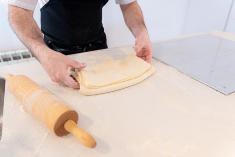 Man baking homemade croissants