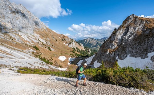 Hiker on hiking trail to the Rote Flueh
