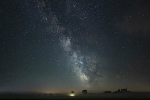 Church of St. Alban with village of Goerwangs and Milky Way with starry sky