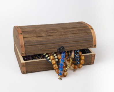 Half-opened wooden box with colourful pearl jewellery