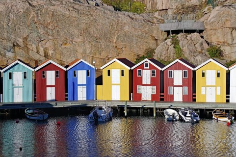 Colourful boathouses and storage sheds in the harbour of the fishing village
