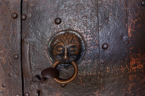 Historic door knocker on the door to the monastery church