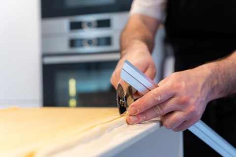 Man baking homemade croissants