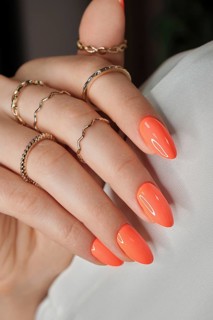 Bright neon manicure on female hands with accessories. Nail design. Beauty hands