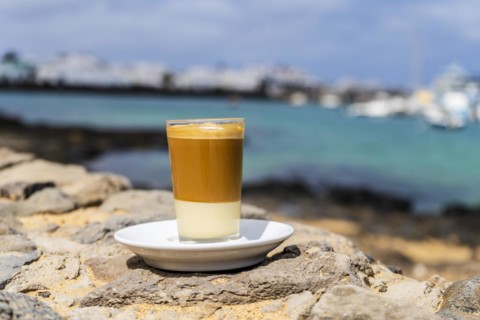 Delicious barraquito coffee with liquor and condensed milk