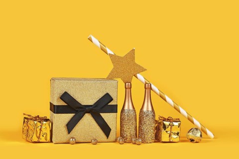New year party arrangement with golden champagne bottles