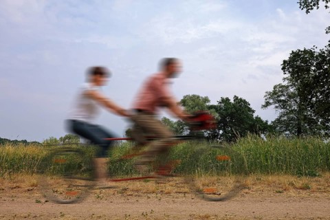 Two people riding on a tandem
