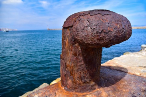 Rusted bollard at a harbour quay in Marseille