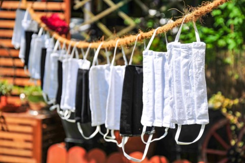 Self-sewn mouth-nose protection masks drying on a clothesline