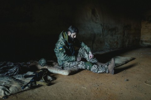 Soldier on his sleeping pad in his units accommodation