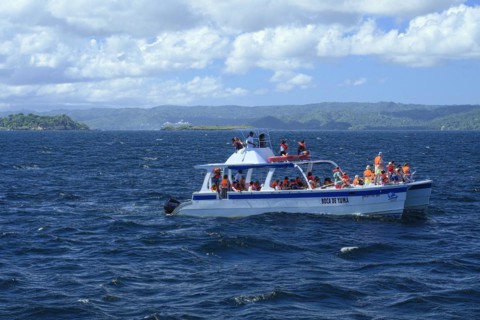 Tourists on a whale watching boat in Samana Bay