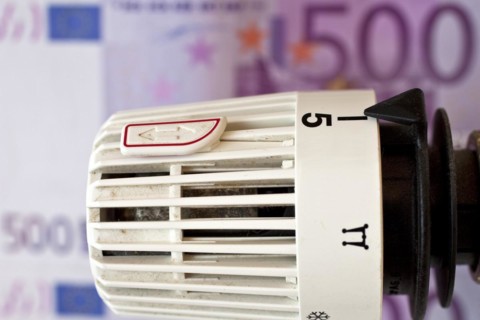 Thermostat in front of five hundred euro note