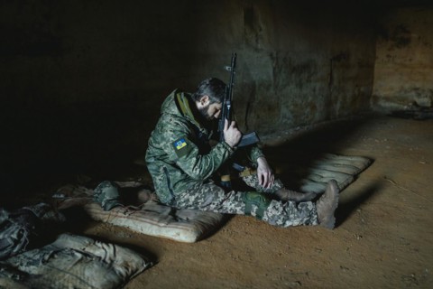 Soldier on his sleeping pad in his units accommodation