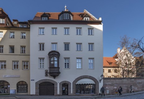 Historic residential and commercial building with a small choir