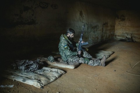 Soldier on his sleeping pad in his units accommodation