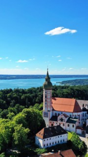 Aerial view of Andechs Monastery with the Lake Ammer lake in the background. Andechs