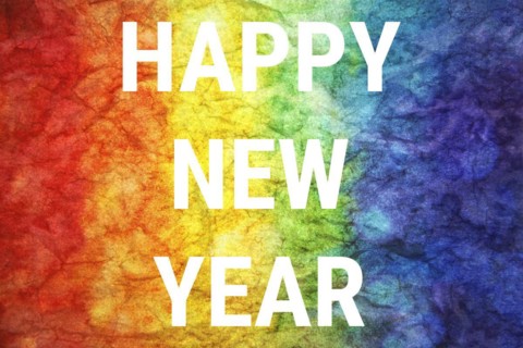 Happy new year words on LGBT textured background