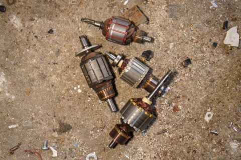 Old coils taken out of electric motors. Recycling of steel waste