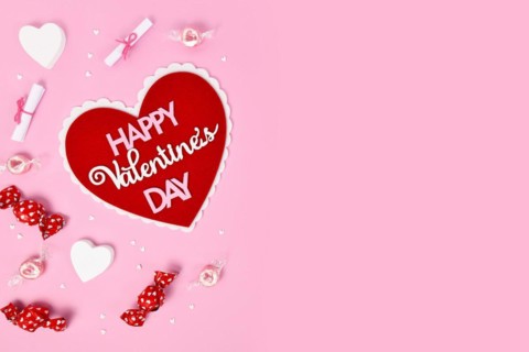 Pink Valentines Day flat lay with heart with text Happy Valentines Day