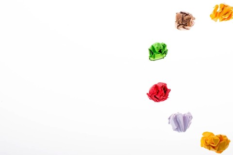 Colorful crumpled paper form a half circle shape