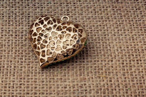 Heart shaped object with an arrow on canvas
