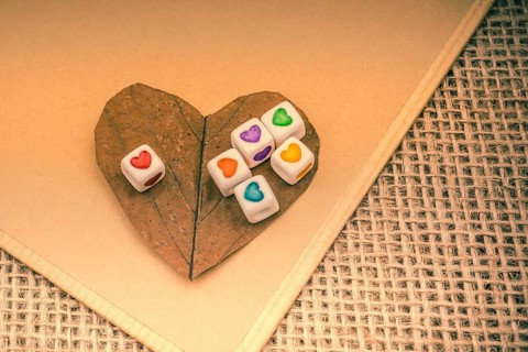 Colorful cubes with a heart on notebook on canvas